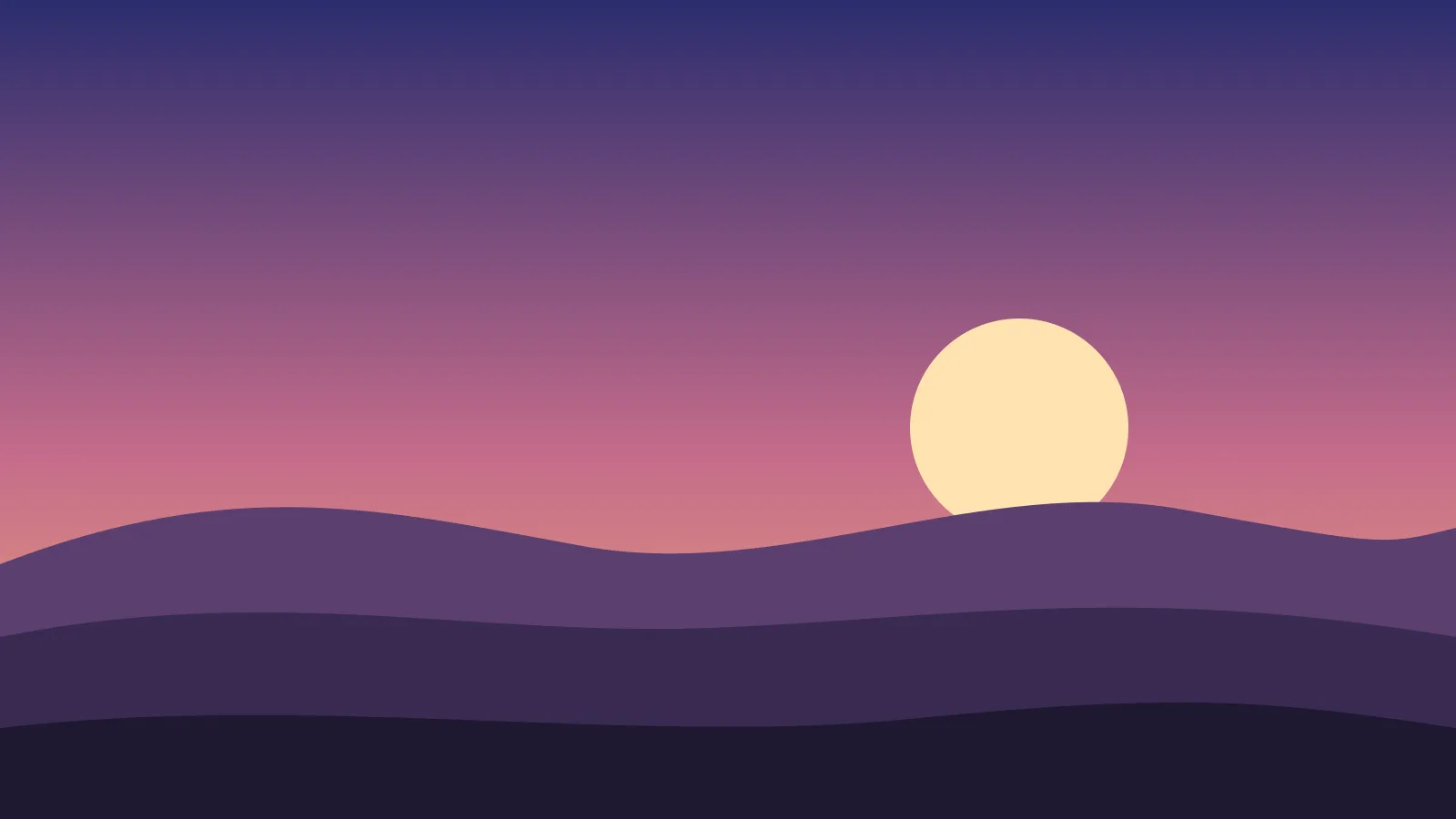 Hills at dusk under a pink sky